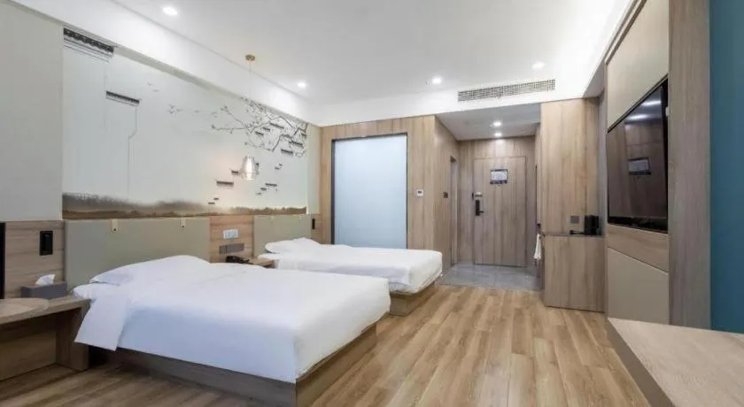 Bed in VX Hotel Jiangsu Taizhou Xinghua RT-Mart