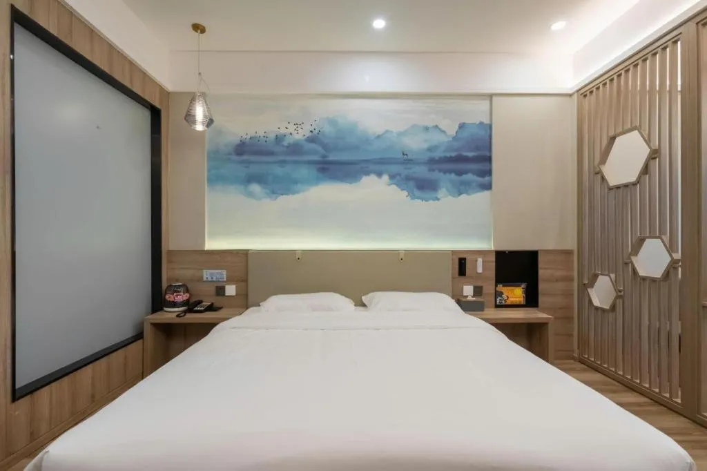 Bed in VX Hotel Jiangsu Taizhou Xinghua RT-Mart