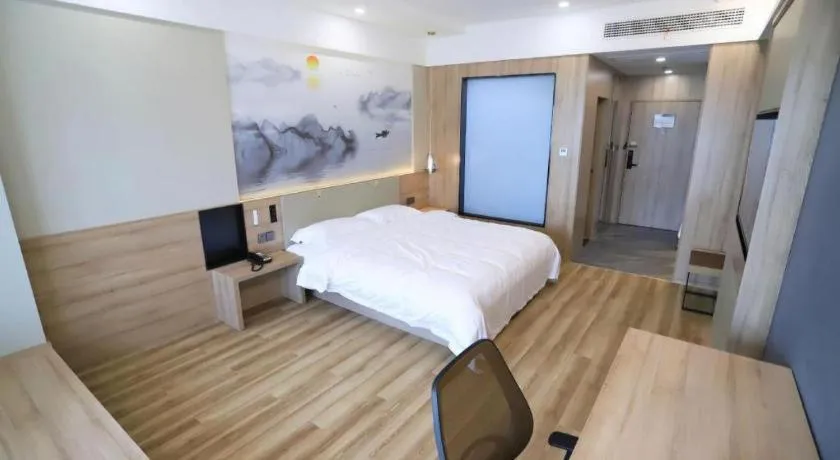 Bed in VX Hotel Jiangsu Taizhou Xinghua RT-Mart