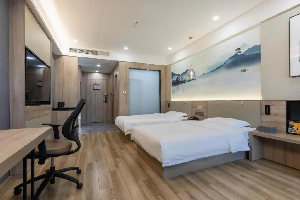 Bed in VX Hotel Jiangsu Taizhou Xinghua RT-Mart