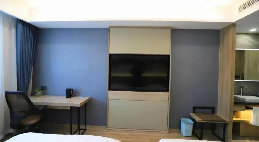 Bed in VX Hotel Jiangsu Taizhou Xinghua RT-Mart