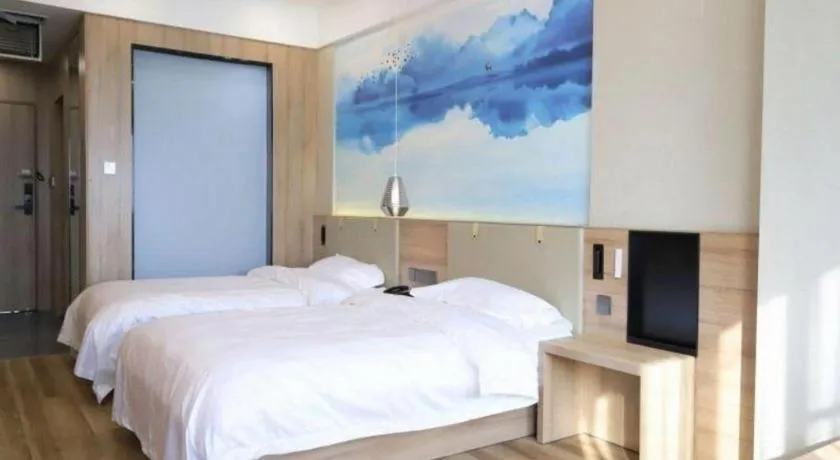 Bed in VX Hotel Jiangsu Taizhou Xinghua RT-Mart