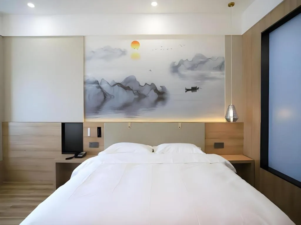 Bed in VX Hotel Jiangsu Taizhou Xinghua RT-Mart