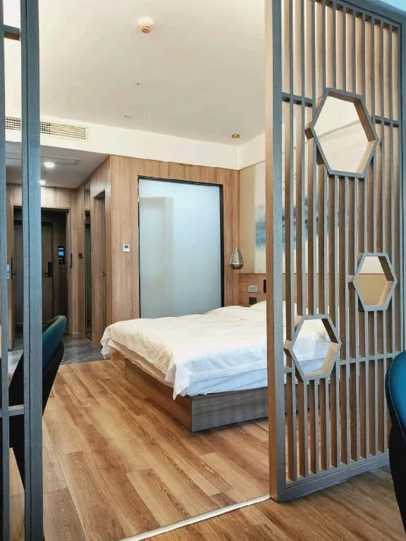 Bed in VX Hotel Jiangsu Taizhou Xinghua RT-Mart