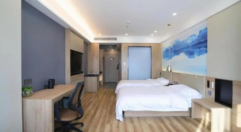 Bed in VX Hotel Jiangsu Taizhou Xinghua RT-Mart