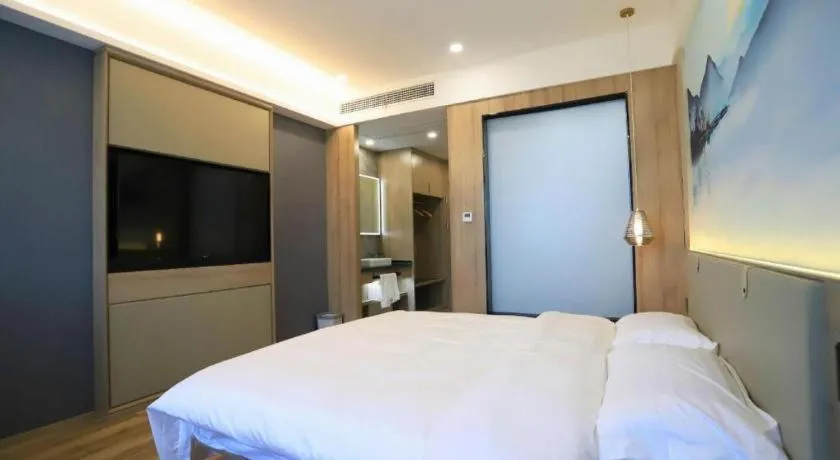 Bed in VX Hotel Jiangsu Taizhou Xinghua RT-Mart