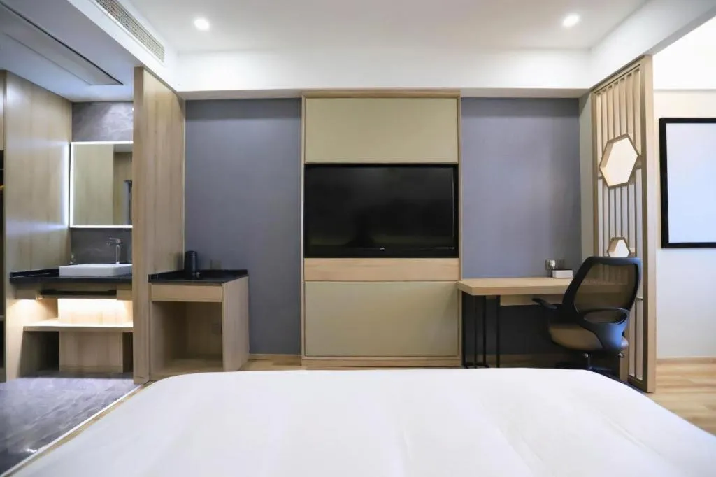 Bed in VX Hotel Jiangsu Taizhou Xinghua RT-Mart