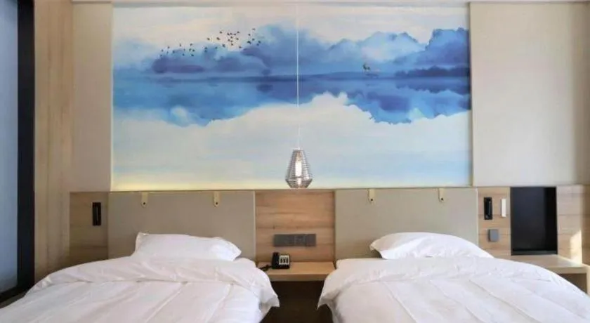 Bed in VX Hotel Jiangsu Taizhou Xinghua RT-Mart