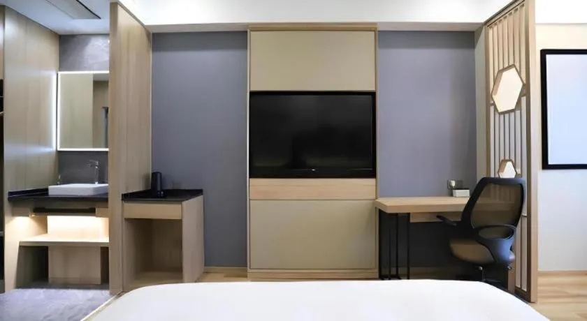 Bed in VX Hotel Jiangsu Taizhou Xinghua RT-Mart