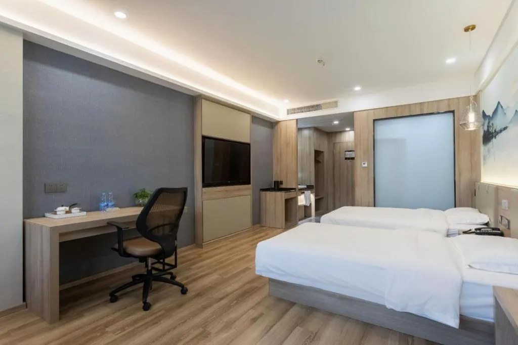 Bed in VX Hotel Jiangsu Taizhou Xinghua RT-Mart