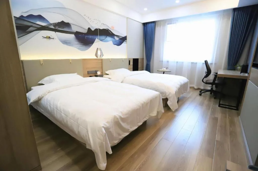 Bed in VX Hotel Jiangsu Taizhou Xinghua RT-Mart