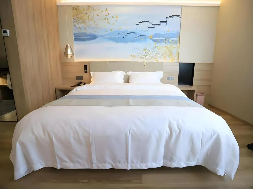 Bed in VX Hotel Jiangsu Taizhou Xinghua RT-Mart
