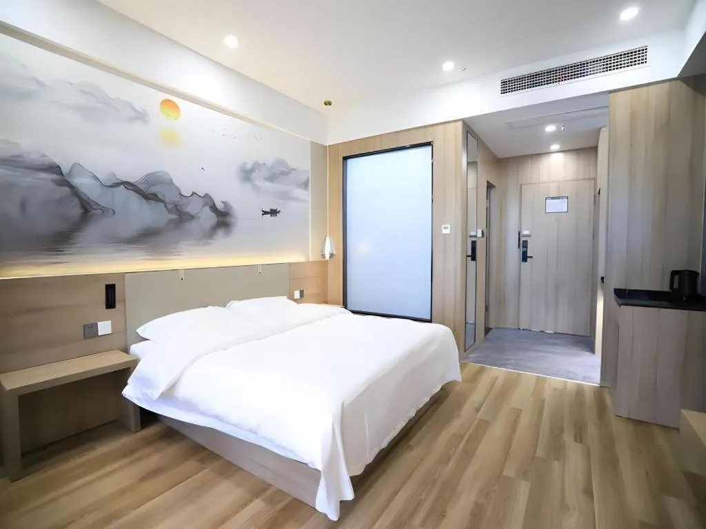 Bed in VX Hotel Jiangsu Taizhou Xinghua RT-Mart