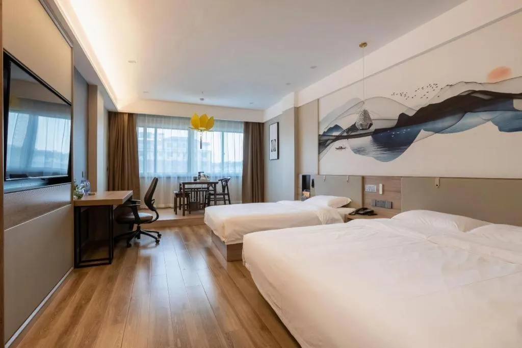 Bed in VX Hotel Jiangsu Taizhou Xinghua RT-Mart