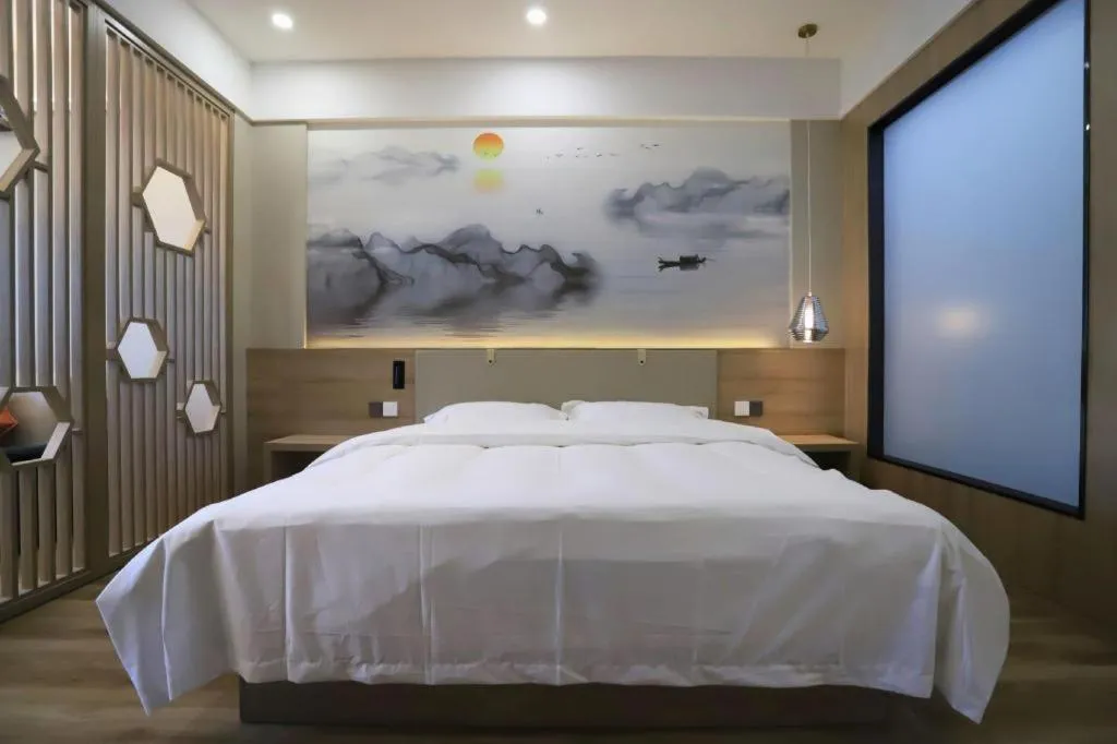 Bed in VX Hotel Jiangsu Taizhou Xinghua RT-Mart