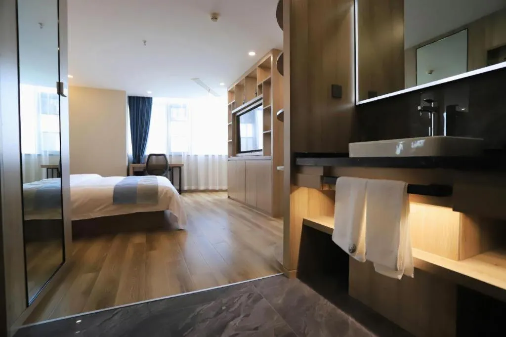 Bed in VX Hotel Jiangsu Taizhou Xinghua RT-Mart