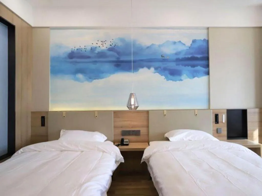 Bed in VX Hotel Jiangsu Taizhou Xinghua RT-Mart