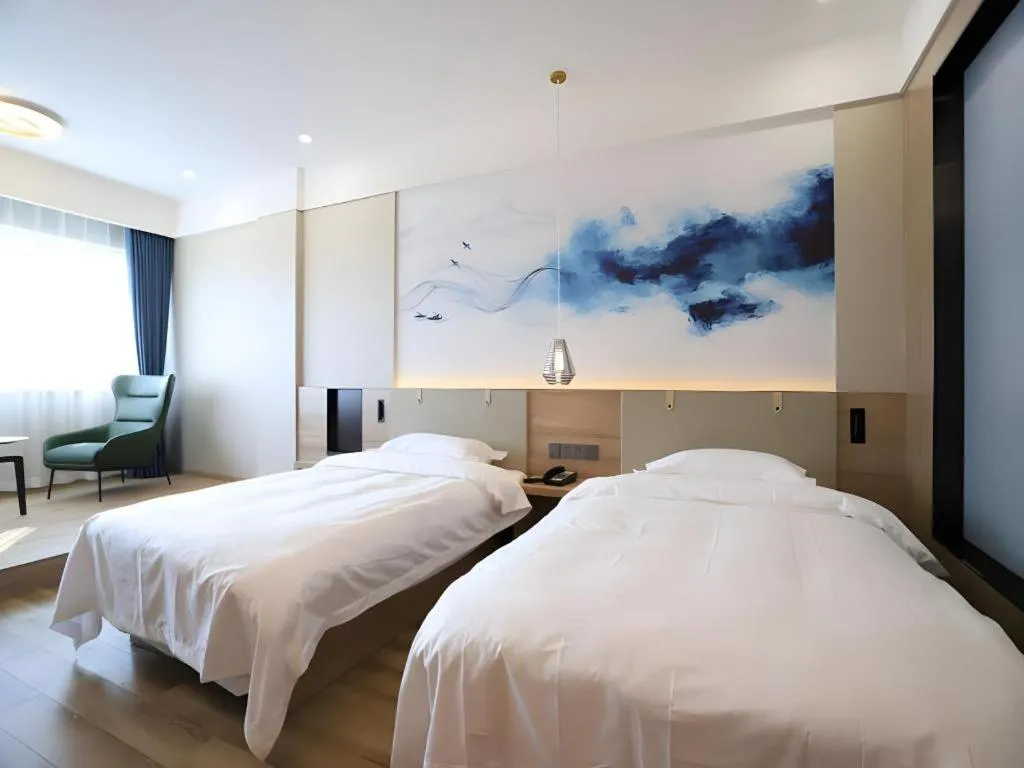 Bed in VX Hotel Jiangsu Taizhou Xinghua RT-Mart