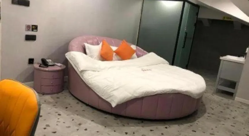 Bed in Shell Hotel Shanghai Jinshan Wanda Plaza