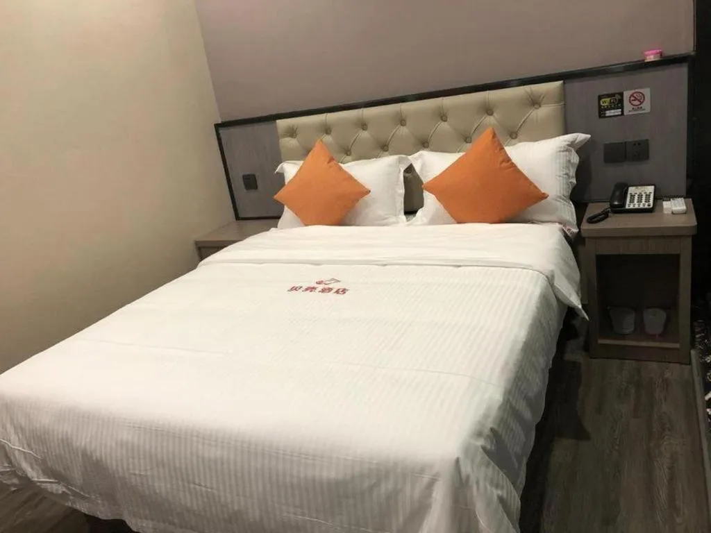 Bed in Shell Hotel Shanghai Jinshan Wanda Plaza