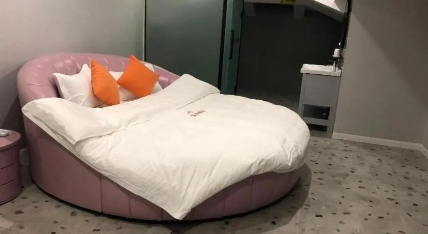 Bed in Shell Hotel Shanghai Jinshan Wanda Plaza