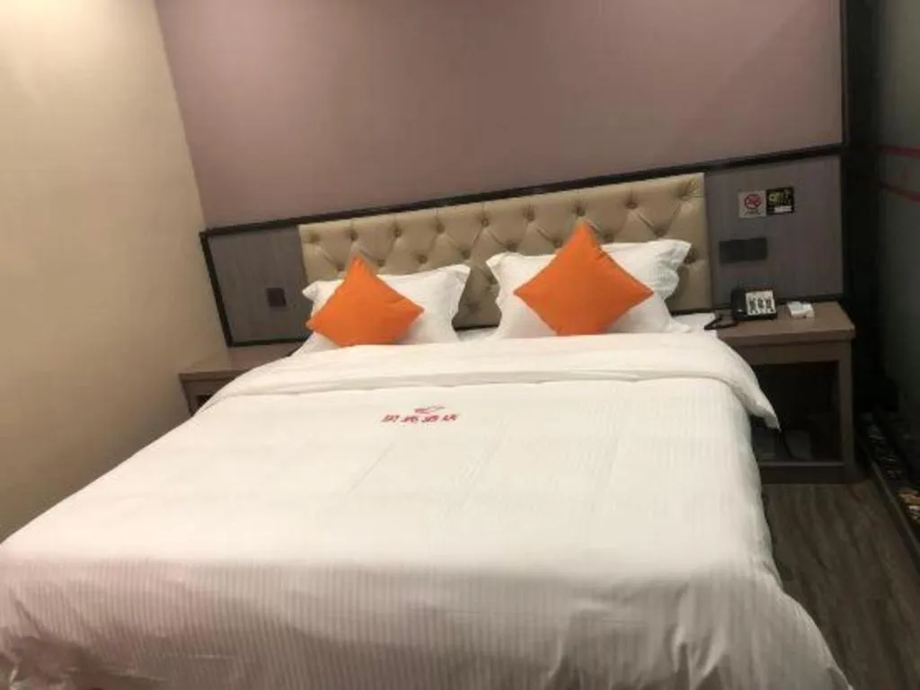 Bed in Shell Hotel Shanghai Jinshan Wanda Plaza