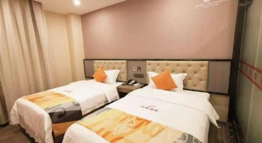 Bed in Shell Hotel Shanghai Jinshan Wanda Plaza