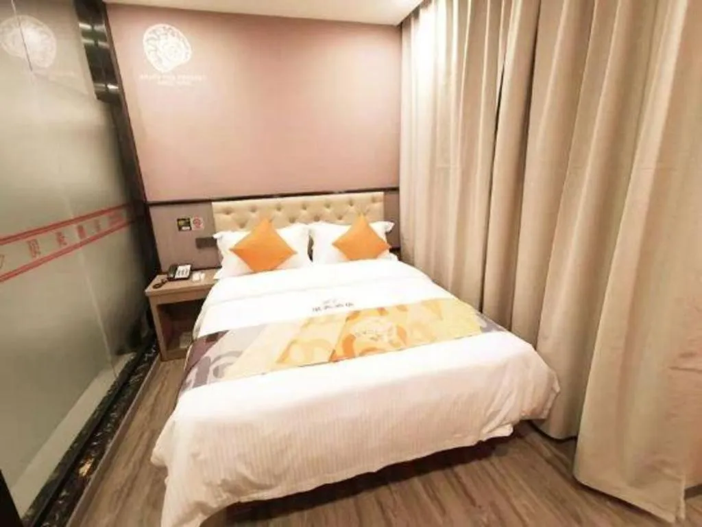Bed in Shell Hotel Shanghai Jinshan Wanda Plaza