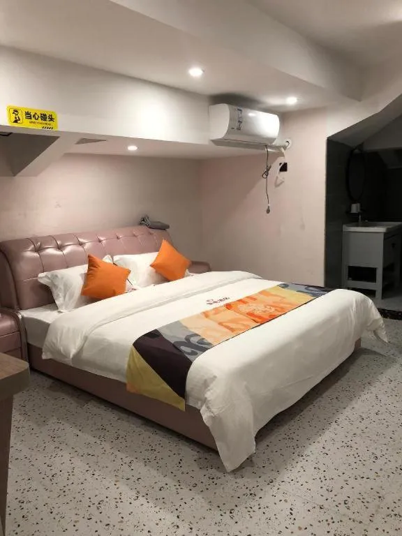 Bed in Shell Hotel Shanghai Jinshan Wanda Plaza