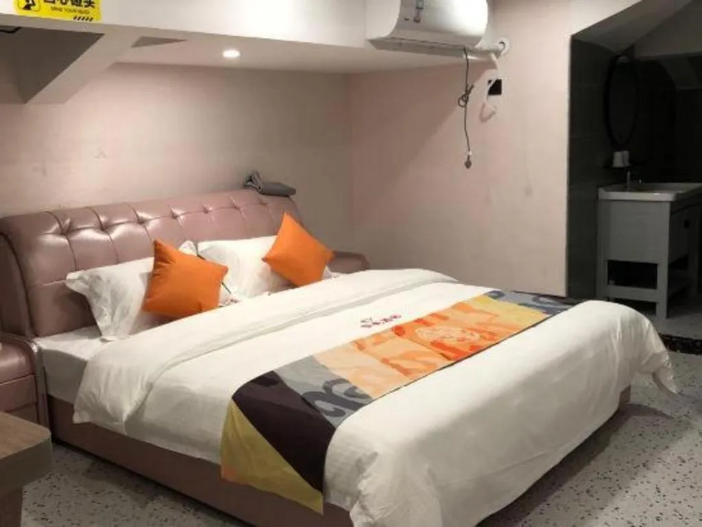 Bed in Shell Hotel Shanghai Jinshan Wanda Plaza