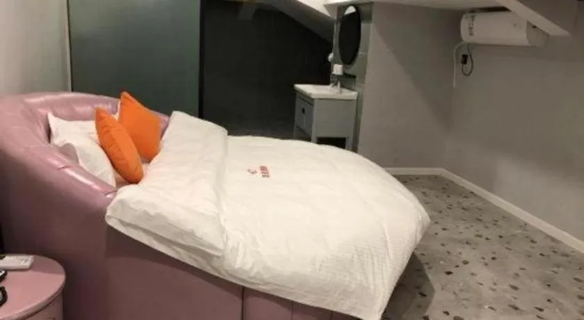 Bed in Shell Hotel Shanghai Jinshan Wanda Plaza