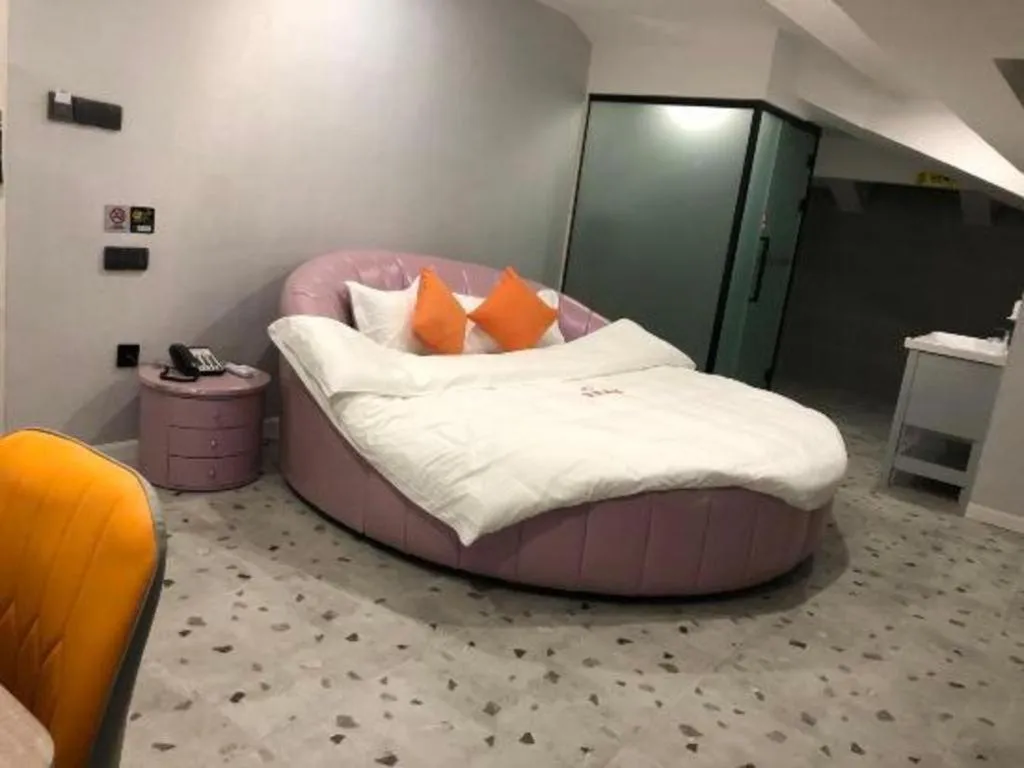 Bed in Shell Hotel Shanghai Jinshan Wanda Plaza