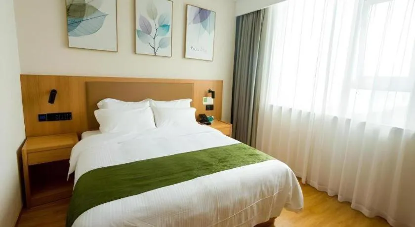Bed in GreenTree Inn Express Henan Xinyang Huaibin County