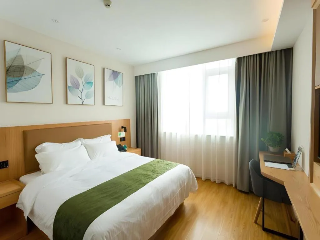 Bed in GreenTree Inn Express Henan Xinyang Huaibin County