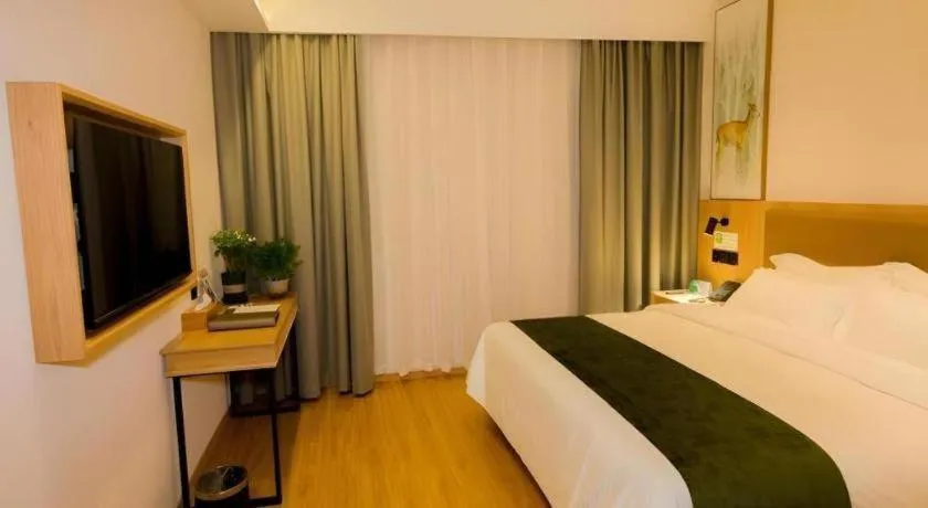 Bed in GreenTree Inn Express Henan Xinyang Huaibin County