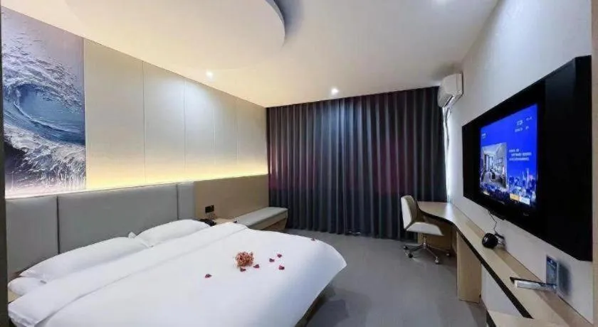 Bed in Super 8 Hotel Dingzhou Chongwen Street
