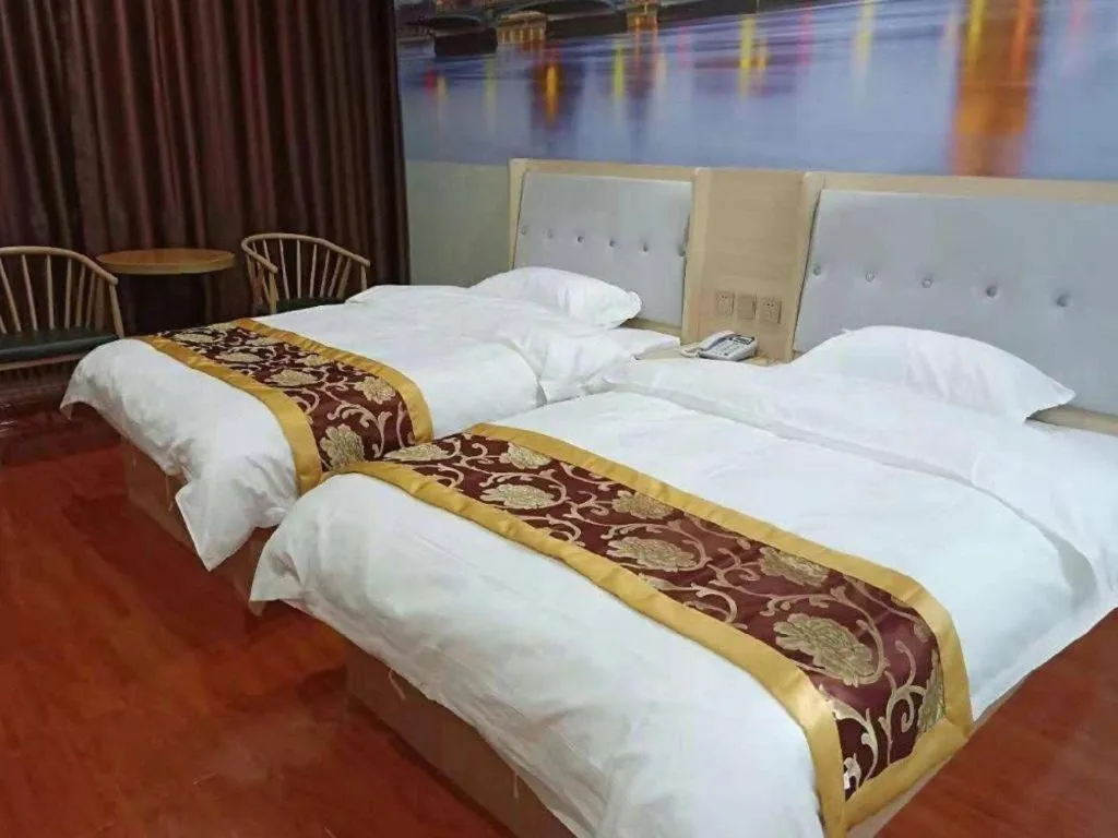 Bed in Super 8 Hotel Dingzhou Chongwen Street