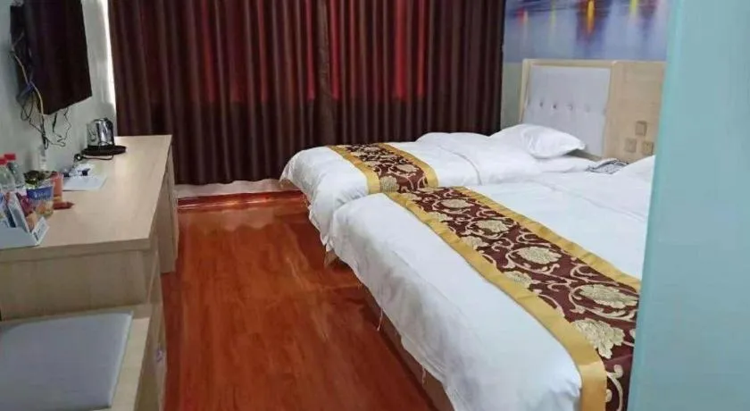 Bed in Super 8 Hotel Dingzhou Chongwen Street