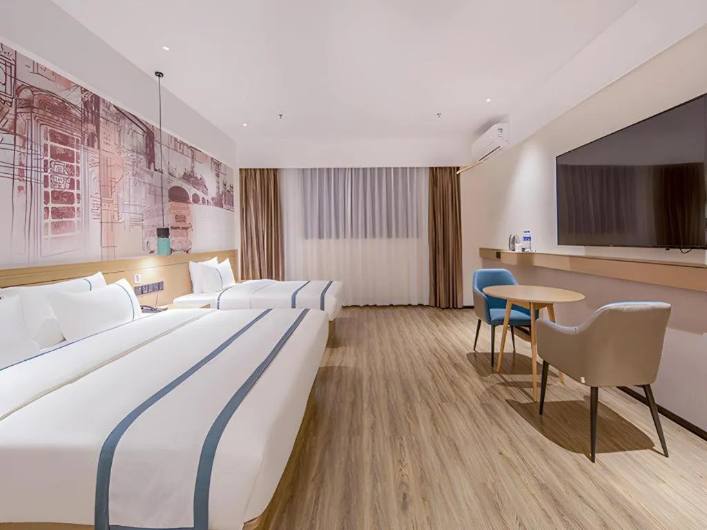 Bed in City Comfort Inn Wuzhou Xijiang Thrid Bridge