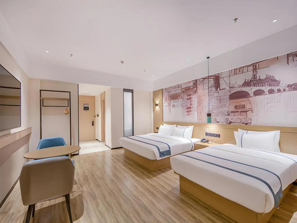 Bed in City Comfort Inn Wuzhou Xijiang Thrid Bridge