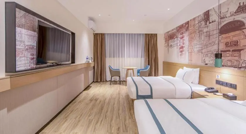 Bed in City Comfort Inn Wuzhou Xijiang Thrid Bridge