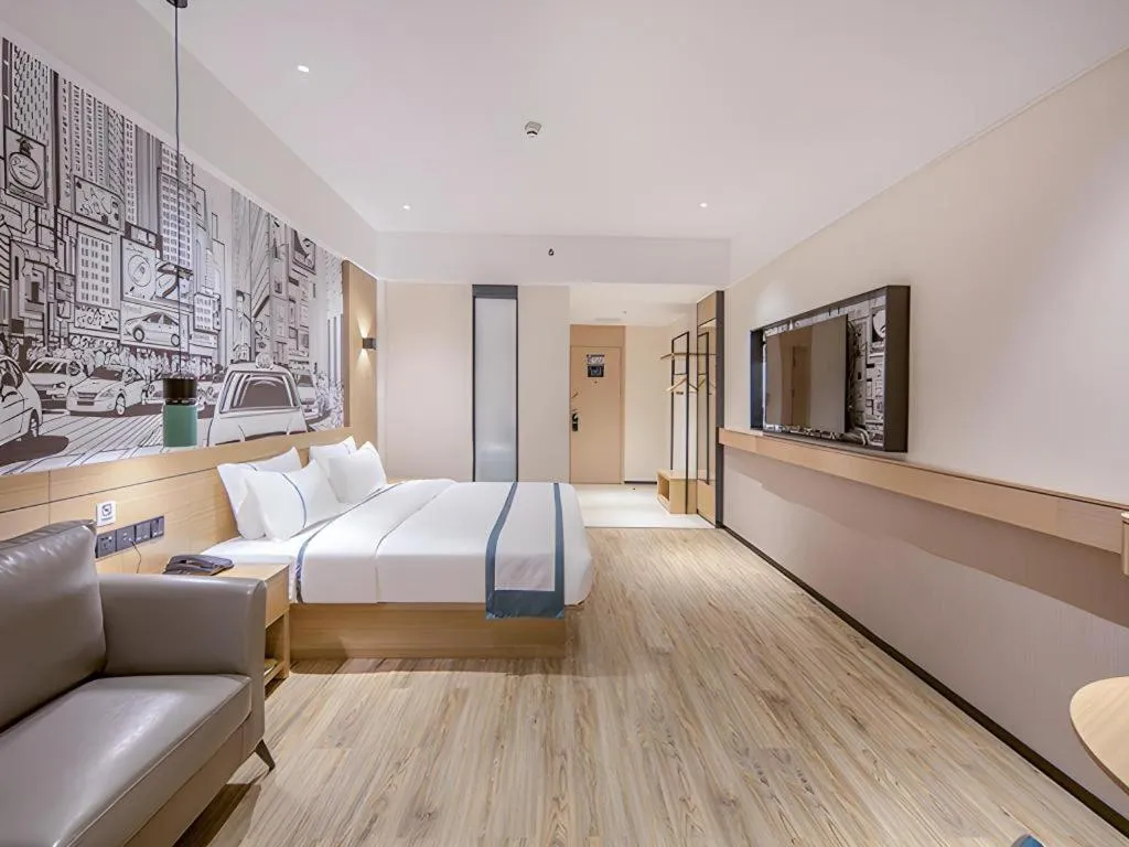 Bed in City Comfort Inn Wuzhou Xijiang Thrid Bridge