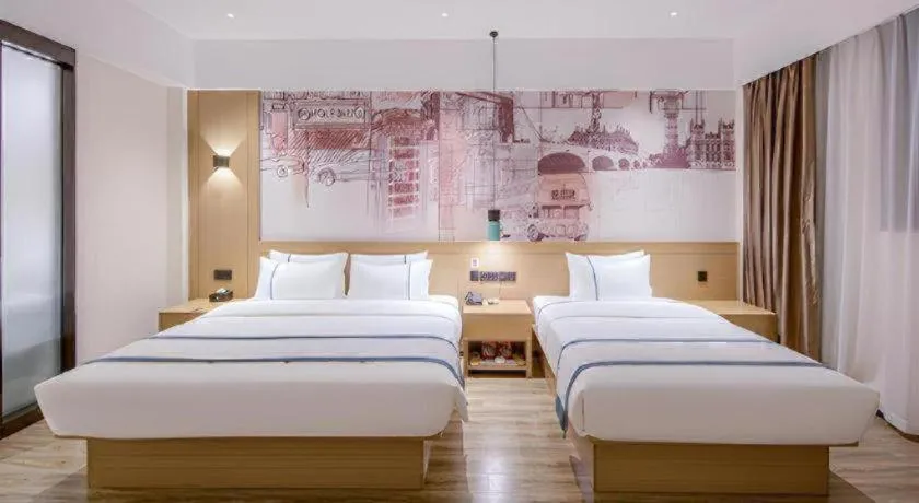 Bed in City Comfort Inn Wuzhou Xijiang Thrid Bridge