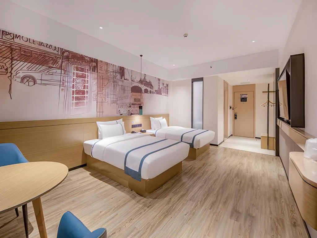 Bed in City Comfort Inn Wuzhou Xijiang Thrid Bridge