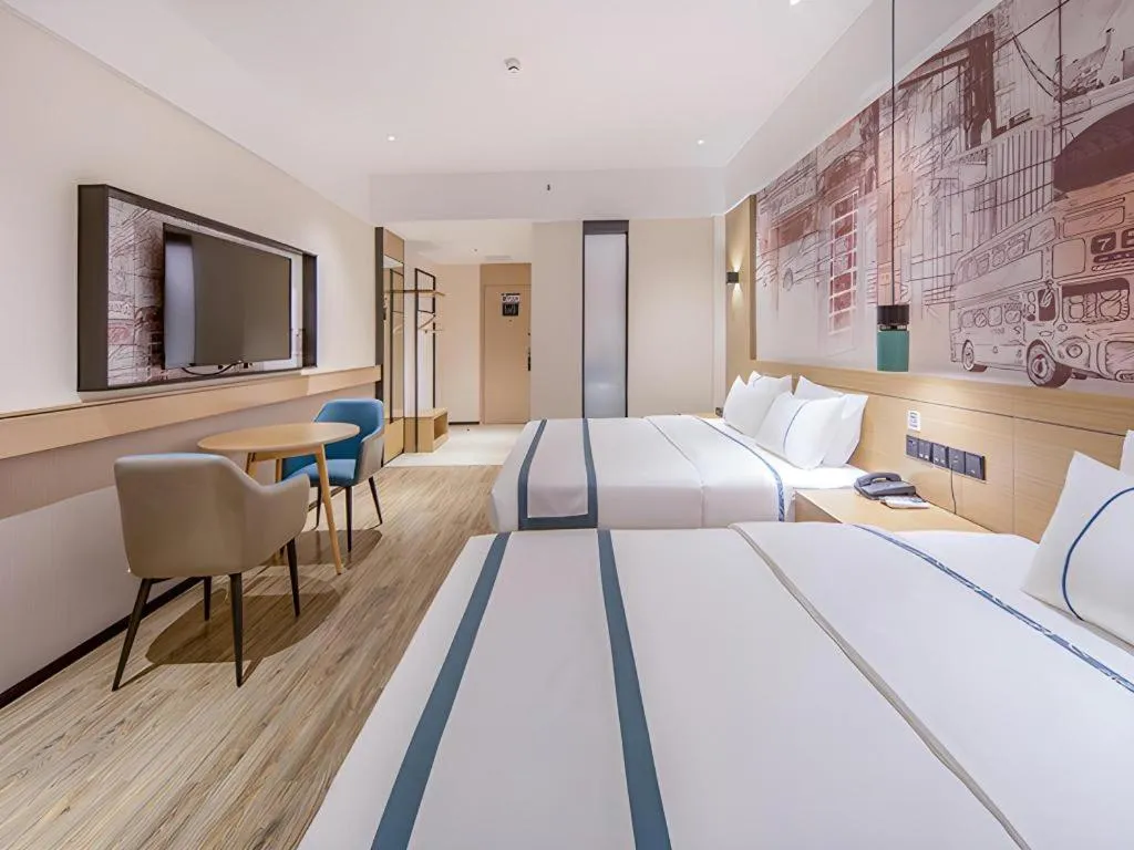 Bed in City Comfort Inn Wuzhou Xijiang Thrid Bridge