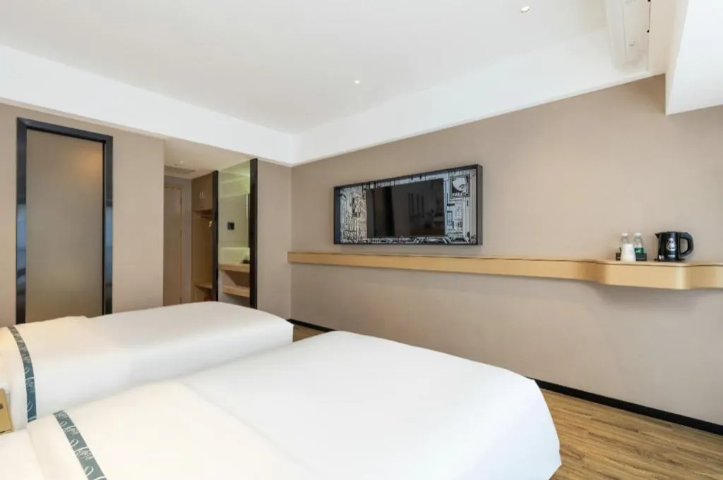 Bed in City Comfort Inn Yunfu Xinxing Juncheng Plaza