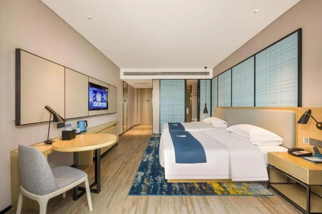 Bed in Echarm Hotel Fangchenggang Qisha