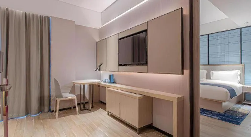 Bed in Echarm Hotel Fangchenggang Qisha