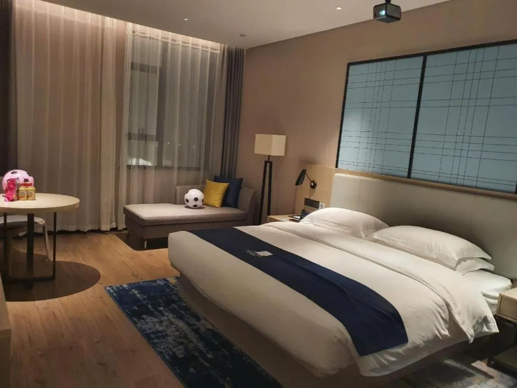 Bed in Echarm Hotel Fangchenggang Qisha