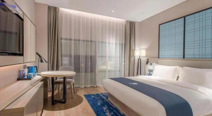 Bed in Echarm Hotel Fangchenggang Qisha